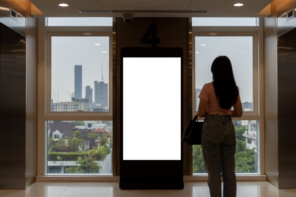 mock up large blank vertical light box wrist watch shop elevator modern building empty space advertising min